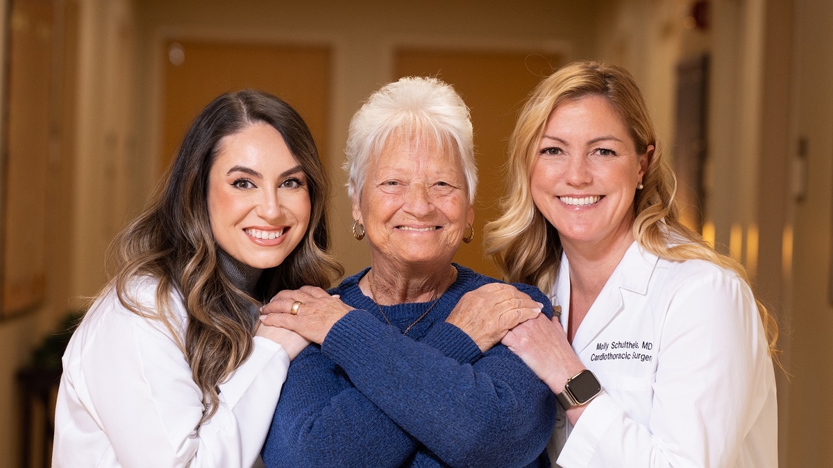 Two female heart doctors with a female heart patient