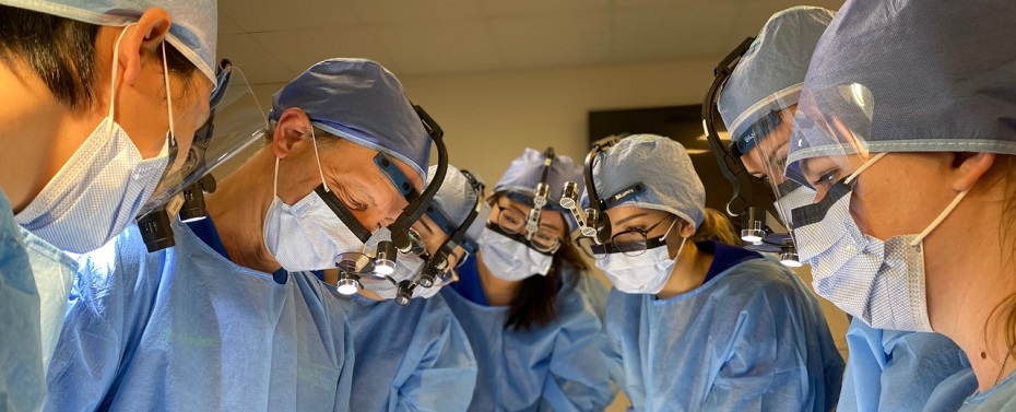 Dentists huddling around a patient