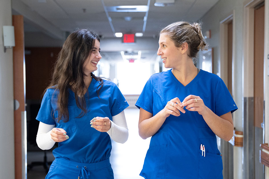 Two nurses in blue scrubs at Englewood Hospital