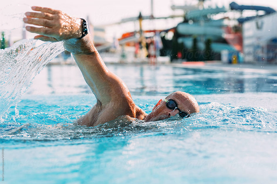 Active senior man swimming