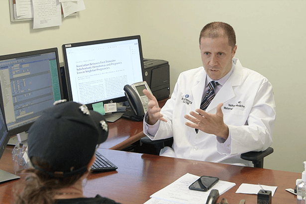 Dr. Nathan Fox in consultation with patient